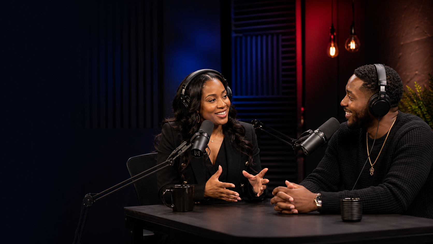 African American female podcast host interviewing a guest in a professional studio